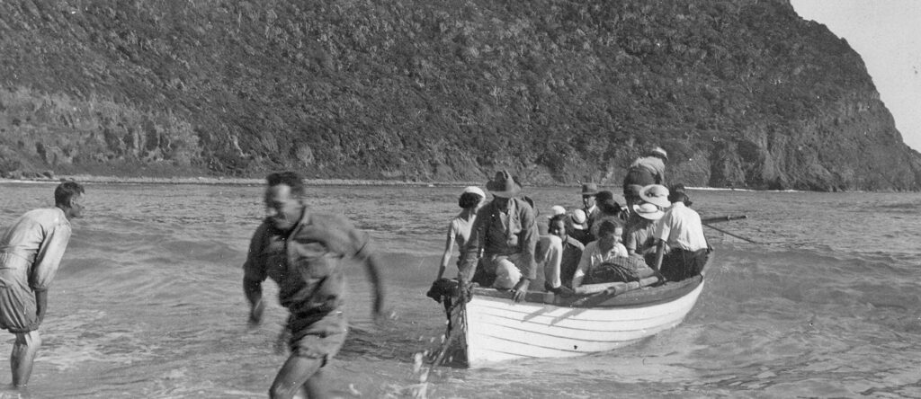 Passengers from the Burns Philp ship Morinda coming ashore at Ned's Beach in 1935.