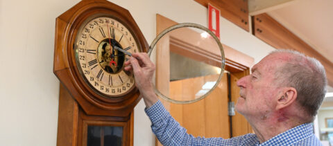 Martin Foster inspecting the Ansonia clock.
