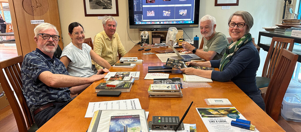 The team of fungus experts identifying photographs at the museum.