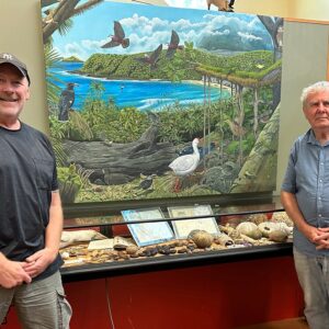 Julian Hume and Ian Hutton, in front of the new mural depicting extinct birds from Lord Howe Island.